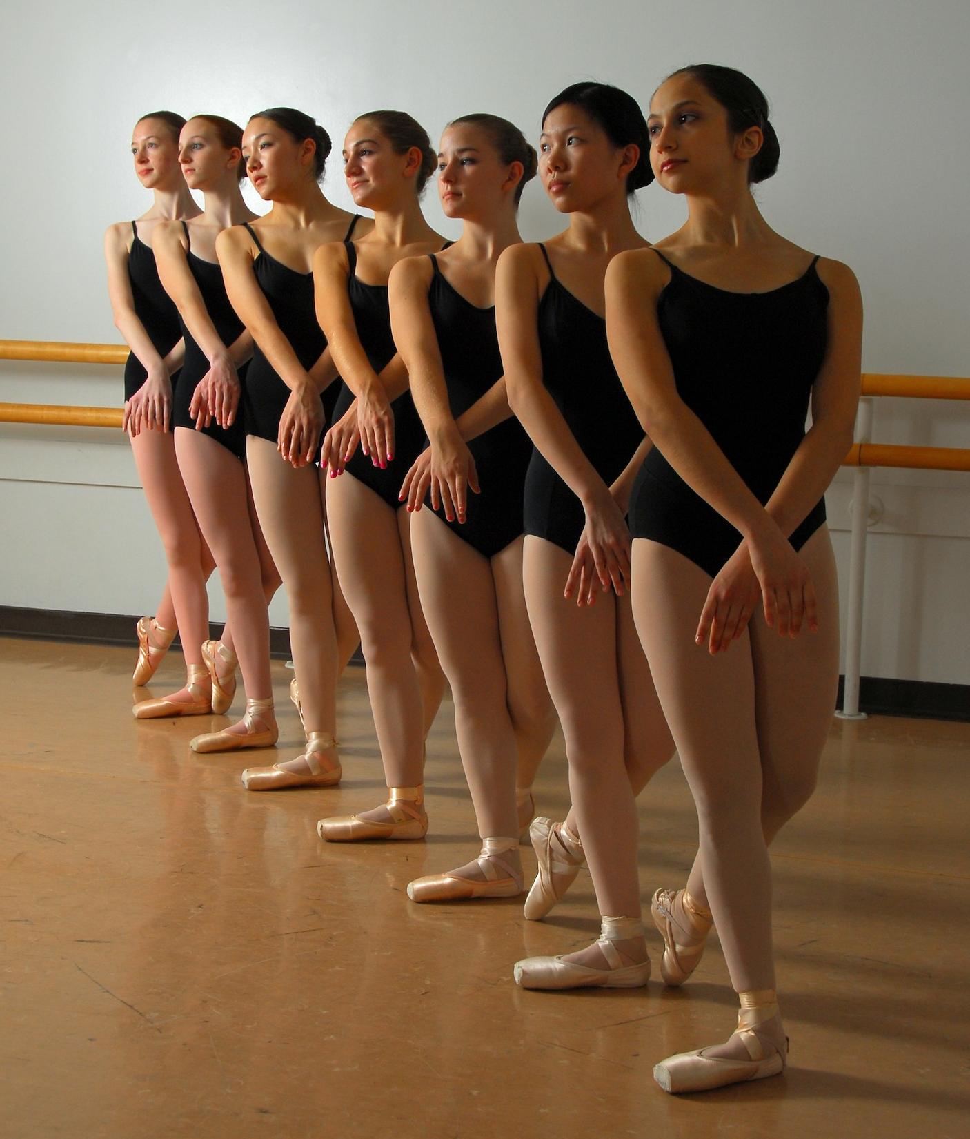 Seven Teenage Ballet Girls wearing White Opaque Lycra Tights and Black Bodysuit